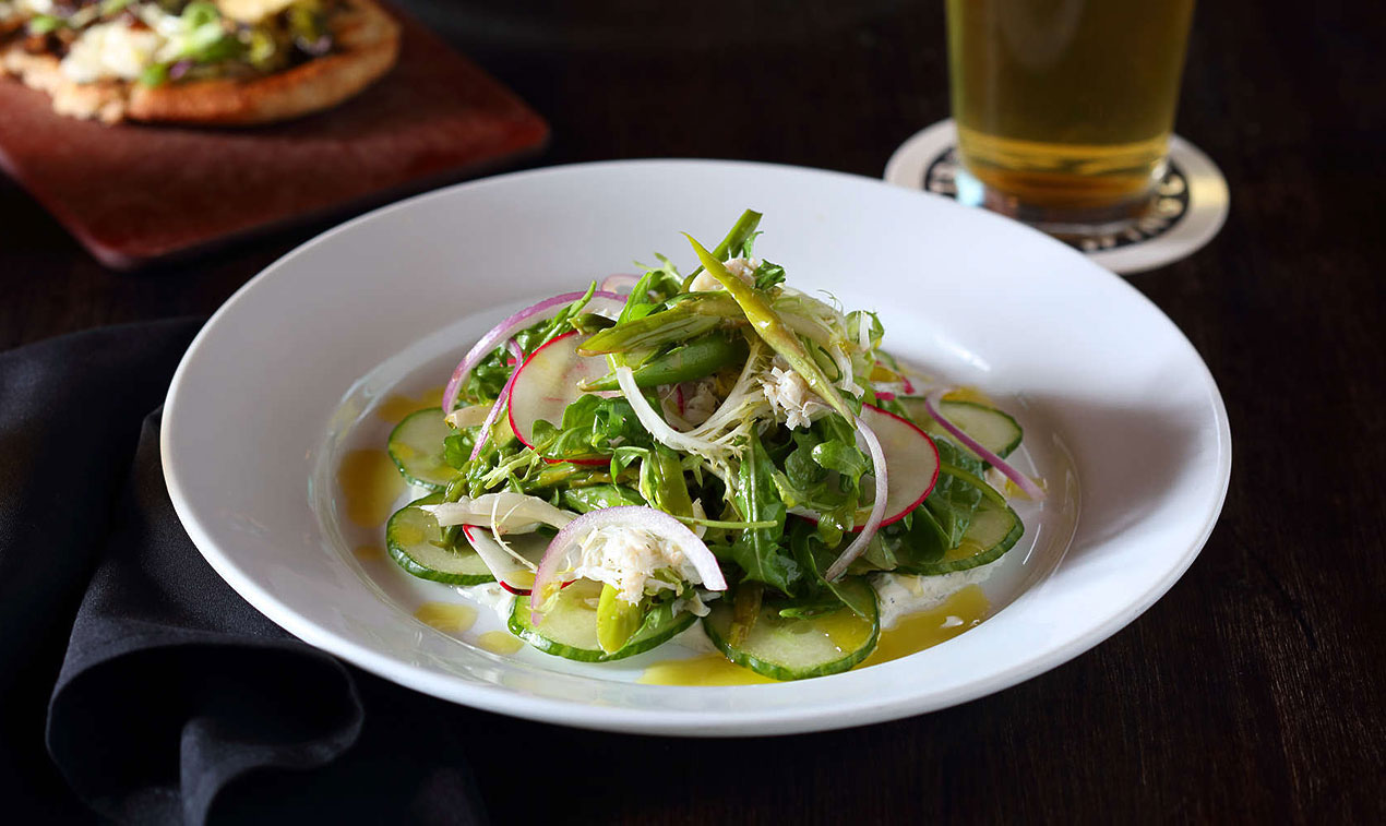 plate with salad and glass with beer