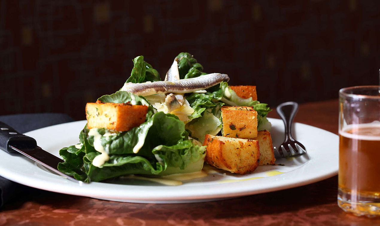plate with salad and glass with beer